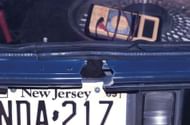 A hole was cut at the rear of the blue 1990 Chevrolet Caprice driven by Muhammad and Malvo, as a firing port to be used during their attacks. (Image via Wikimedia Commons)